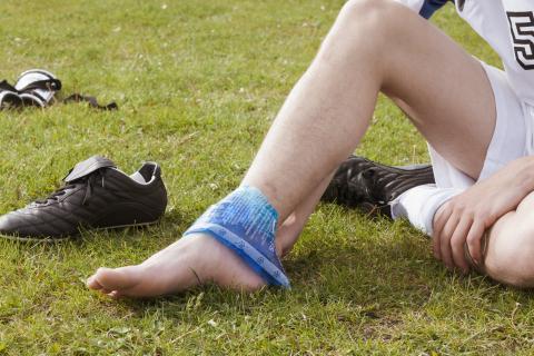 Soccer player icing their ankle